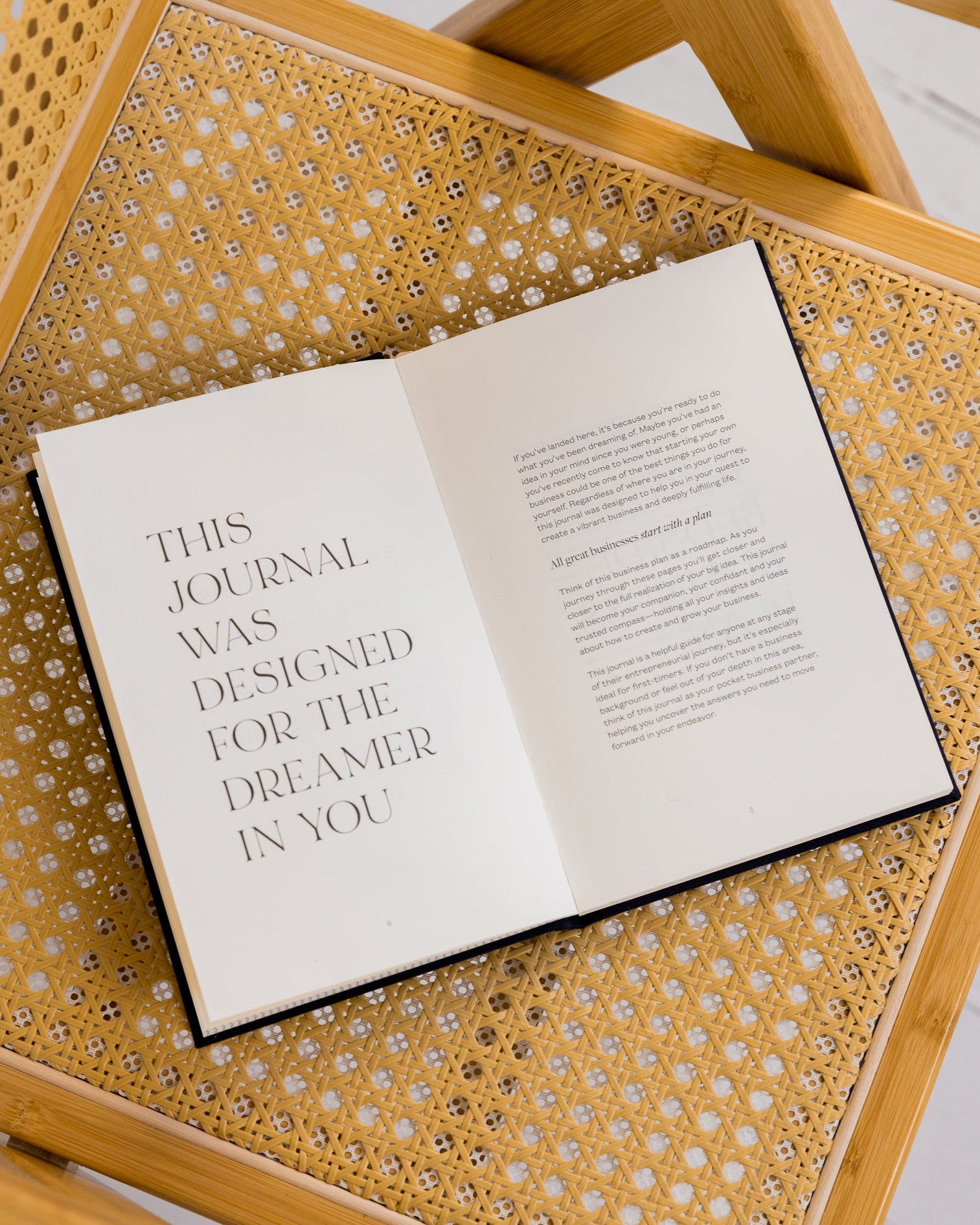 Open Bedside Business Plan guided journal on a textured surface with text about design for dreamers