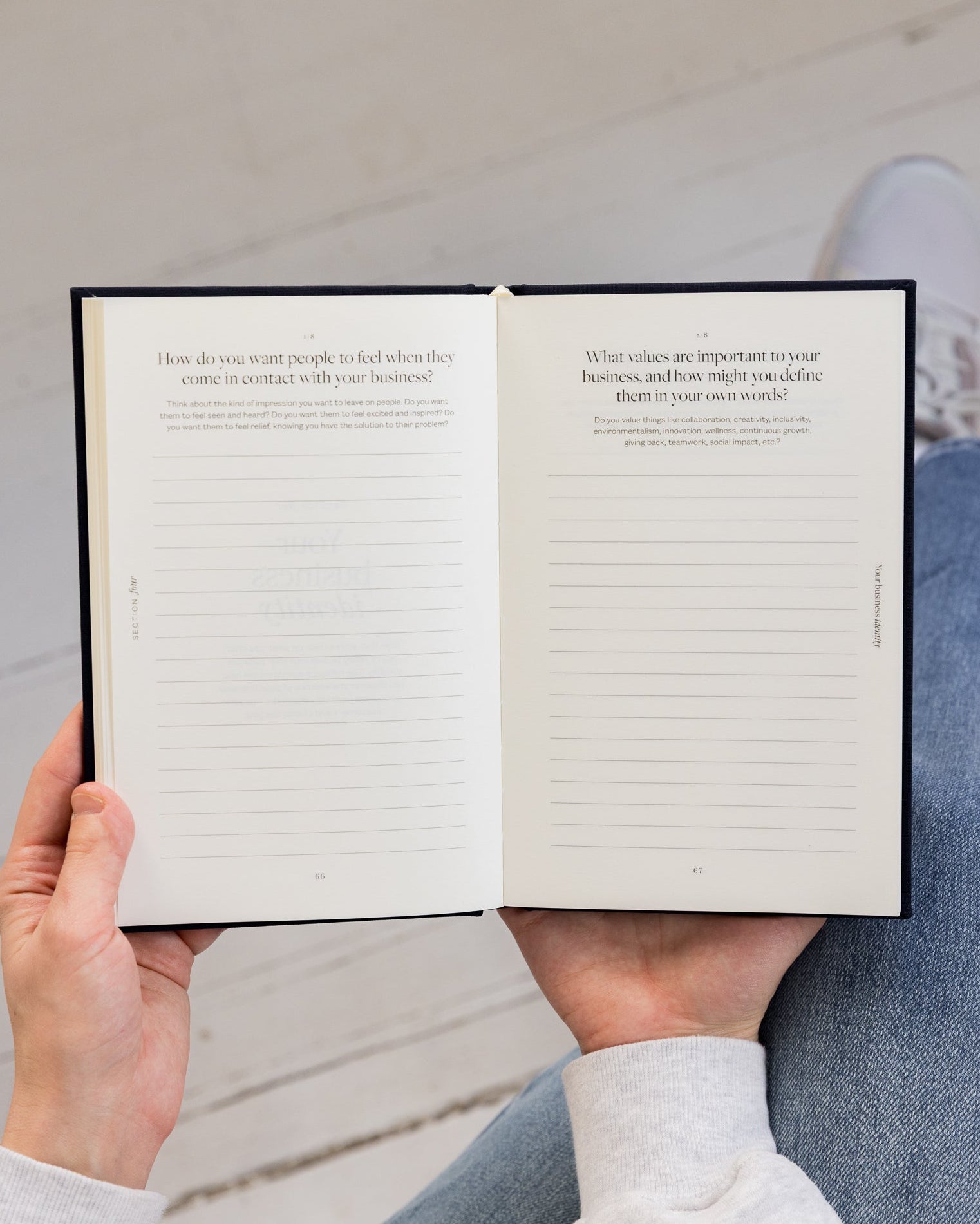 Person holding Bedside Business Plan with a blurred background