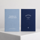 Two hardcover books standing upright on a white pedestal against a light gray wall. The left book is light blue with white text reading 'Employee to Entrepreneur,' and the right book is dark navy with white text reading BEDSIDE BUSINESS PLAN