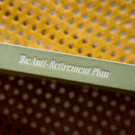 Cover of a book titled 'The Anti-Retirement Plan' with a textured yellow and brown cover.